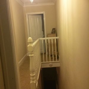 Upstairs-hallway-and-stairs-before-restoration